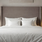 Serene luxury bedroom with a king-size bed and upholstered headboard.